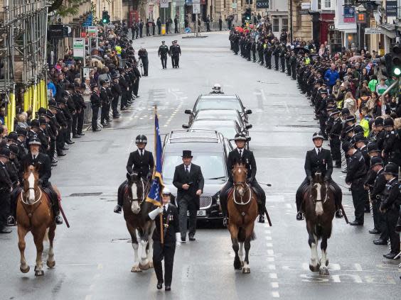 Hundreds of mourners line Oxford’s high street to pay their respects to PC Andrew Harper in October last year (PA)