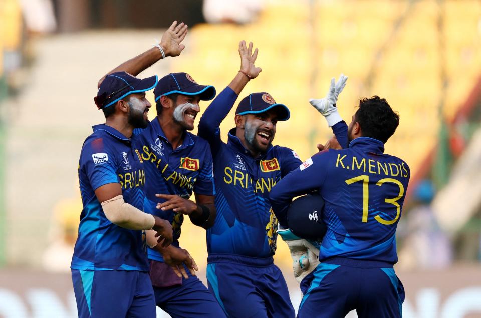 Sri Lanka celebrate the quick-thinking run out to dismiss Rashid (REUTERS)