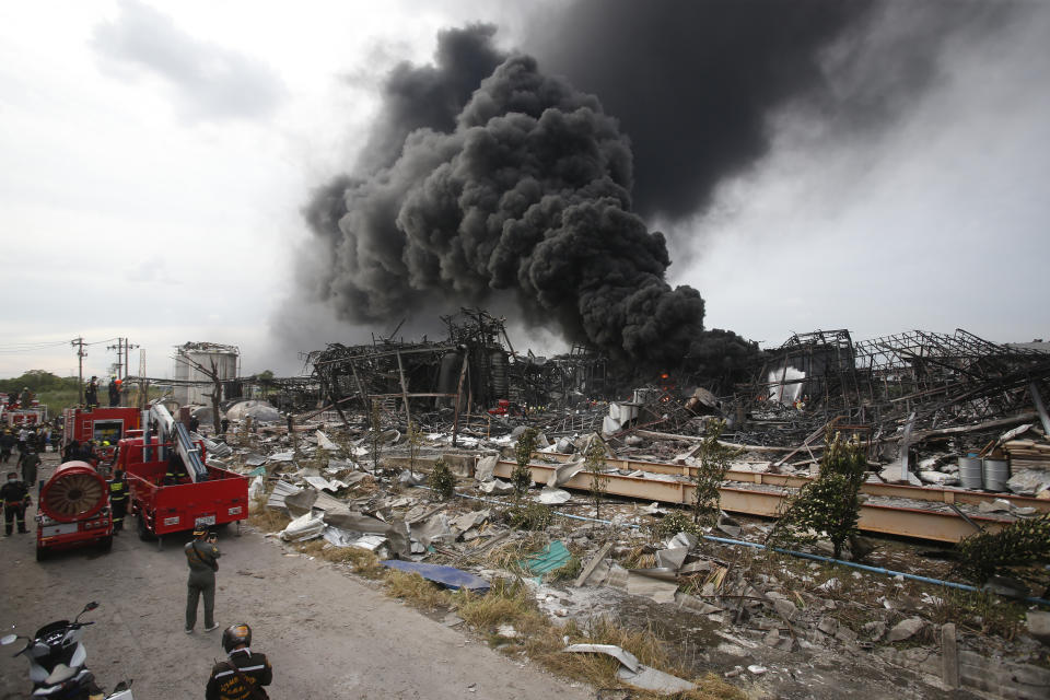 Firefighters work to extinguish a fire at the site of a massive explosion in Samut Prakan province, Thailand, Monday, July 5, 2021. A massive explosion at a factory on the outskirts of Bangkok has damaged homes in the surrounding neighborhoods and prompted the evacuation of a wide area over fears of poisonous fumes from burning chemicals and the possibility of additional denotations. At least one person has been killed and dozens have been injured. (AP Photo)