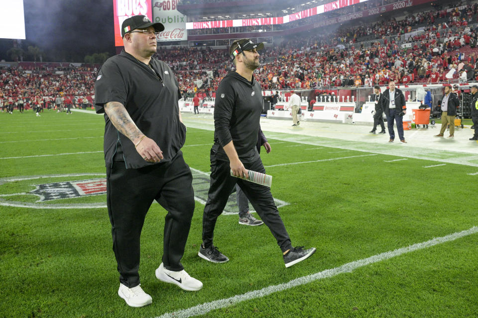Philadelphia Eagles head coach Nick Sirianni, right, walks with chief security officer Dom DiSandro following an NFL wild-card playoff football game against the Tampa Bay Buccaneers, Monday, Jan. 15, 2024, in Tampa, Fla. The Buccaneers won 32-9. (AP Photo/Phelan M. Ebenhack)