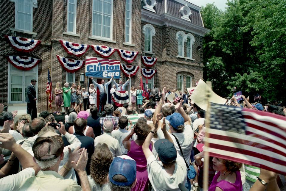 Arkansas Gov. and Democratic presidential hopeful Bill Clinton, left, and his running mate, Sen. Al Gore, raises their arms during an old-fashioned rally under a scorching sun on the square of Gore's hometown of Carthage, Tenn., July 11, 1992.