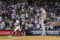 New York Mets starting pitcher Max Scherzer, right, reacts as New York Yankees' Aaron Judge, back left, rounds the bases after hitting a home run in the third inning of a baseball game, Monday, Aug. 22, 2022, in New York. (AP Photo/Corey Sipkin)
