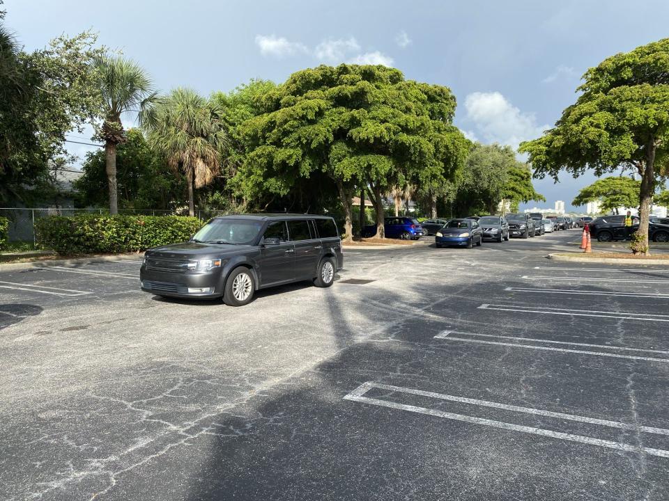 Cars wait in line Saturday, June 22, 2024, at the University Preparatory Academy in West Palm Beach during the Urban League of Palm Beach County's Summer Food Drive. The organization distributed food and water to families in need at three sites in Palm Beach County.