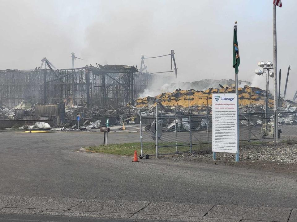 Wreckage from a collapsed warehouse in Finley continued to smolder a day later.