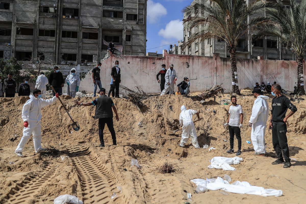 Gazan authorities removed the remains of Palestinians from what they claimed was a mass grave (Anadolu/Getty)