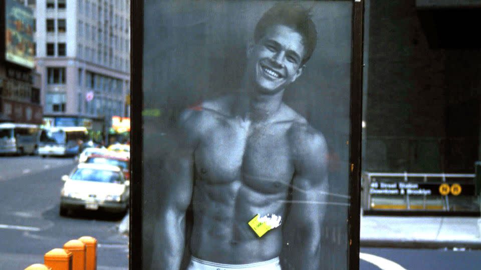 Adorning a New York City phonebooth, Mark Wahlberg is seen in a 1992 Calvin Klein campaign. - Henry McGee/MediaPunch/AP