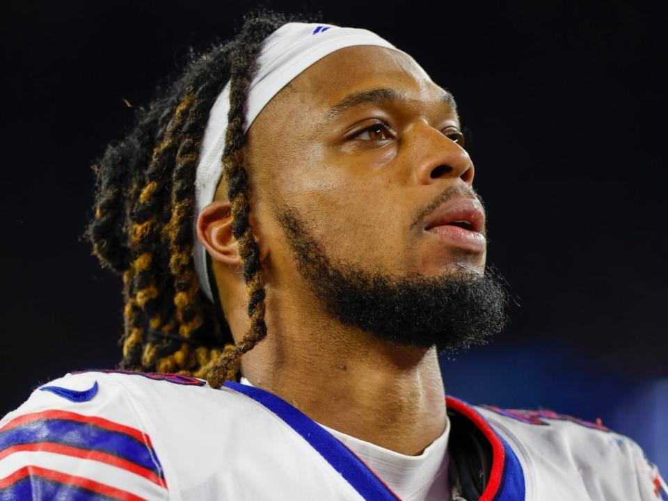 Buffalo Bills defensive back Damar Hamlin, seen here after a game against the New England Patriots on Saturday, remains in intensive care in a Cincinnati hospital. He collapsed following a tackle during a game against the Bengals on Monday.   (Greg M. Cooper/The Associated Press - image credit)