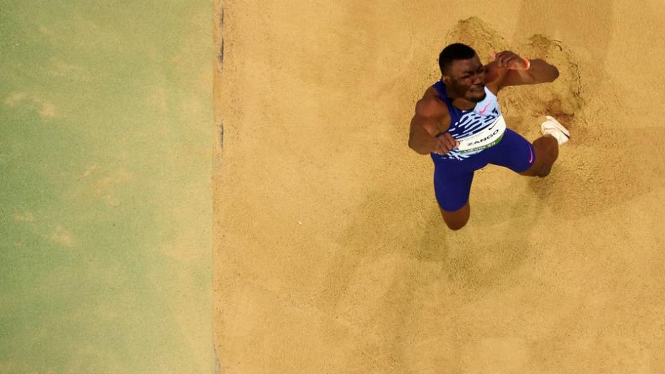 Hugues Fabrice Zango of Burkina Faso competes in the triple jump final.