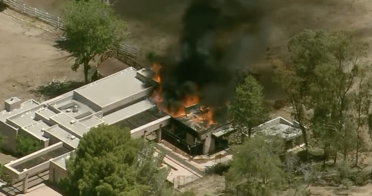 <p>A fire at the house of the suspect in a fatal shooting at a fire station in California</p> (Fox 11 News / screengrab)