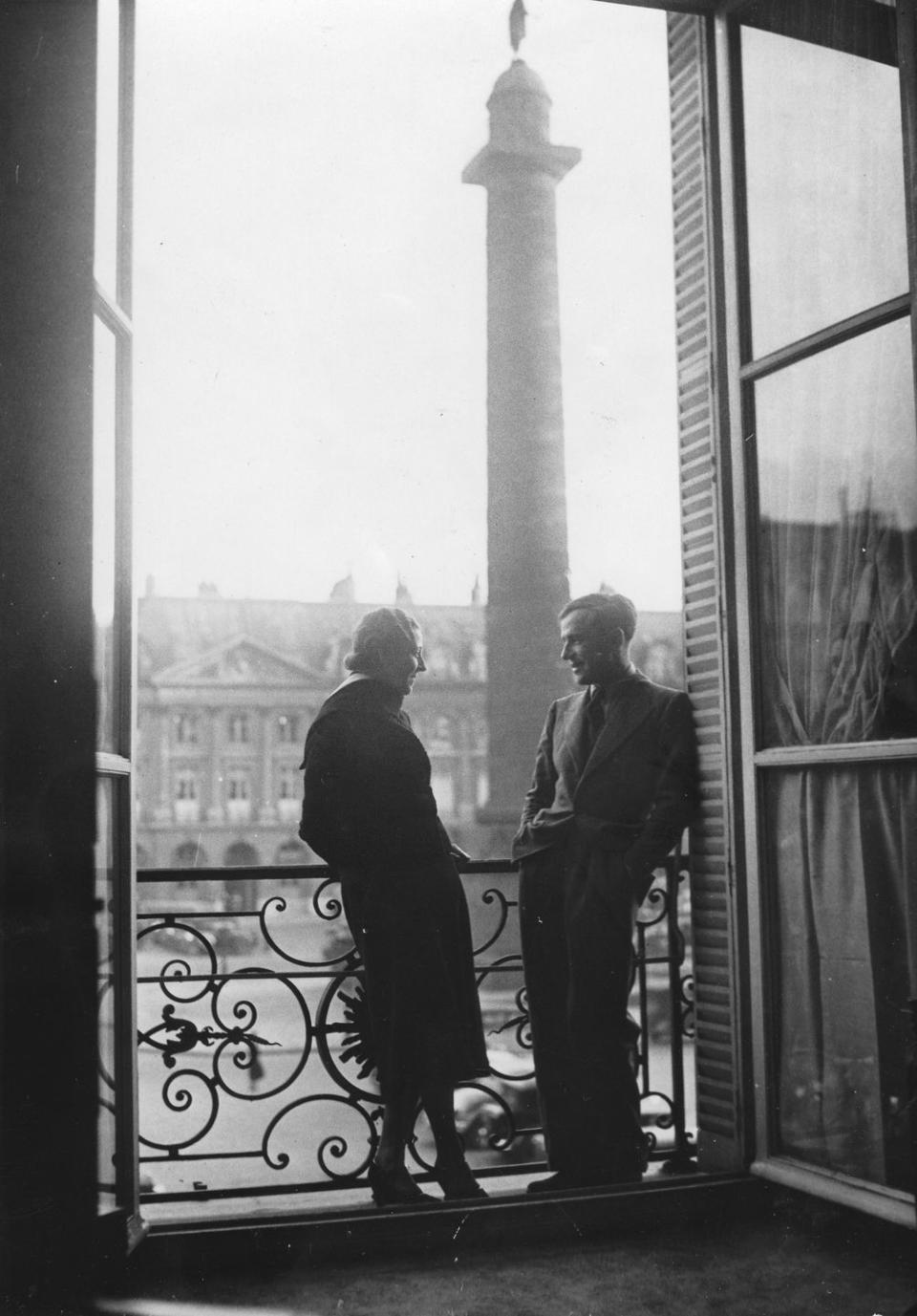 British pilots Amy Johnson and Jim Mollison stand on a balcony in 1932