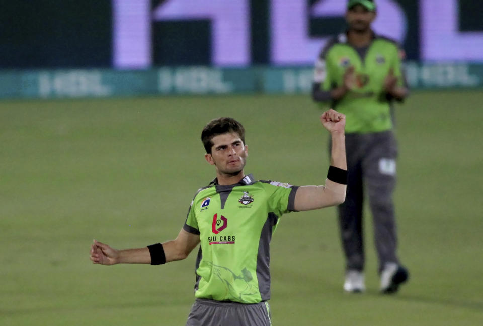 Shaheen Afridi celebrates after taking the wicket of Karachi Kings' Waqas Maqsood during a Pakistan Super League T20 cricket match between Karachi Kings and Lahore Qalandars at the National Stadium, in Karachi, Pakistan, Sunday, Feb. 28, 2021. (AP Photo/Fareed Khan)