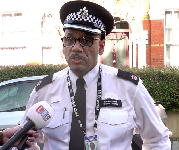 Superintendent Gabriel Cameron reading a statement to the media on Lesser Avenue, near Clapham Common, south London.