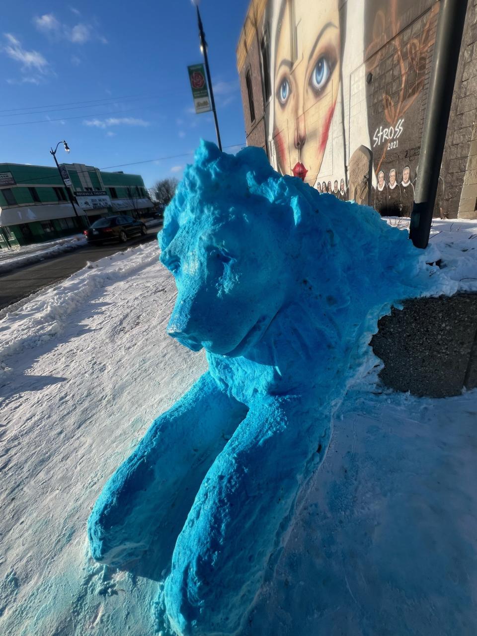 Edward Stross, an artist and self-proclaimed lifelong Lions fan, sculpted a lion outside his Roseville art studio out of snow to honor the Detroit team's winning season.