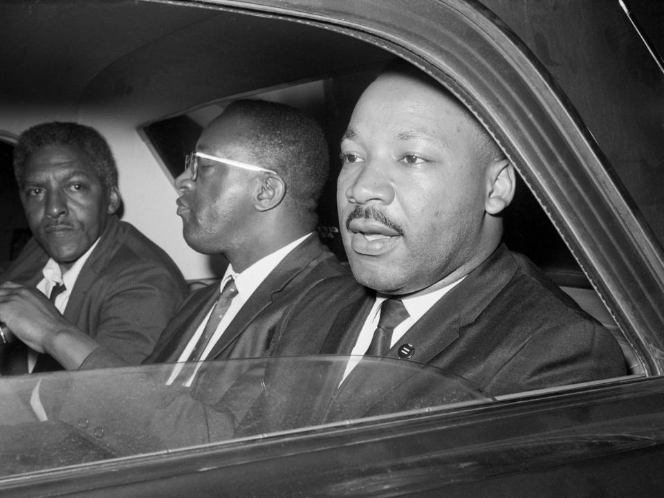 After meeting with New York Mayor Wagner to discuss racial tension in Harlem and Brooklyn, Dr. Martin Luther King, Jr. (r), Bayard Rustin (left), and Rev. Bernard Lee, (c) leave Gracie Mansion.