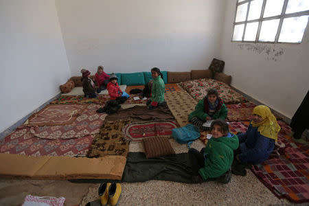 Students sit on mats inside a classroom at the 'Aisha Mother of the BelieversÕ school which was recently reopened after rebels took control of al-Rai town from Islamic State militants, Syria January 16, 2017. Picture taken January 16, 2017. REUTERS/Khalil Ashawi