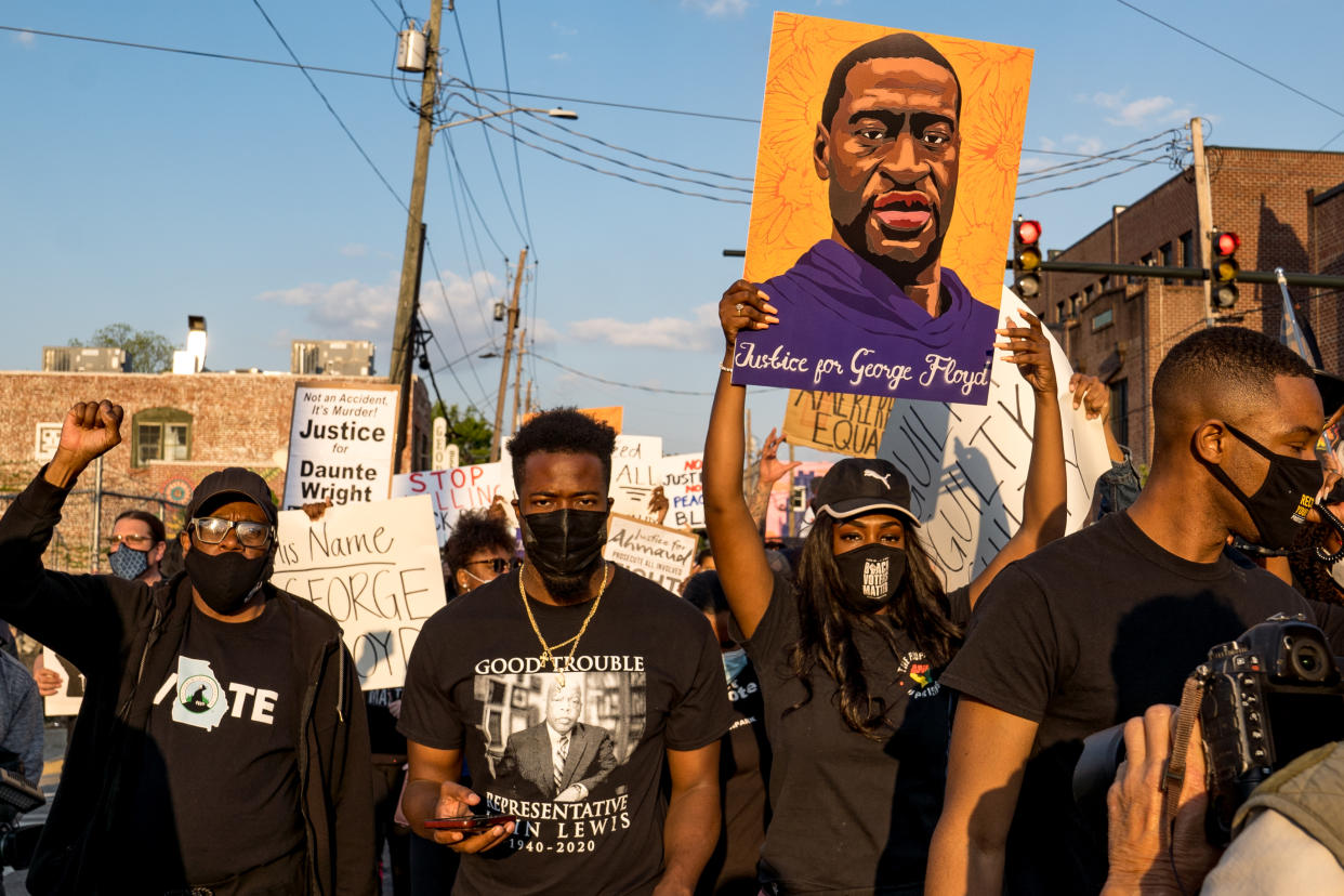 People march through the streets after the verdict was announced for Derek Chauvin on April 20, 2021 in Atlanta.