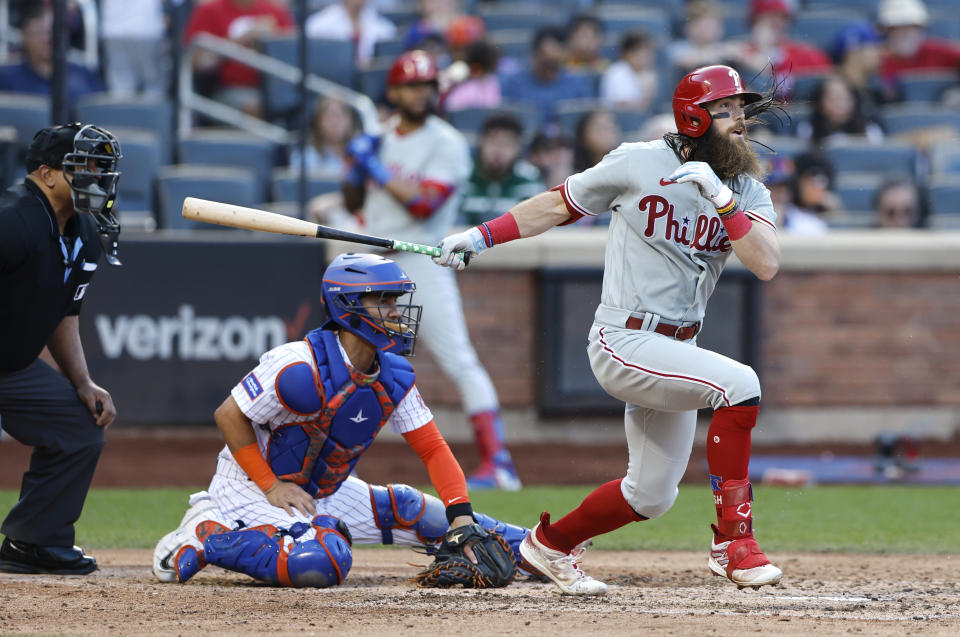 Phillies' Brandon Marsh follows through on a single against the New York Mets during the eight inning of a baseball game, Sunday, Oct. 1, 2023, in New York. (AP Photo/Noah K. Murray)