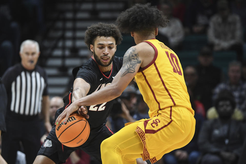 Gonzaga forward Anton Watson (22) steals the ball from Southern California forward DJ Rodman (10) during the first half of an NCAA college basketball game Saturday, Dec. 2, 2023, in Las Vegas. (AP Photo/Sam Morris)