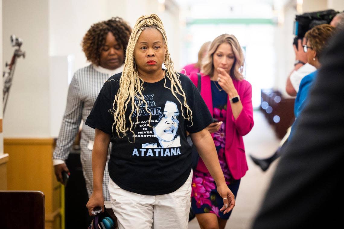 A group wearing Atatiana Jefferson shirts comes into the courtroom for a recusal hearing on Judge David Hagerman’s status in the Aaron Dean case on June 23, 2022, in Fort Worth.