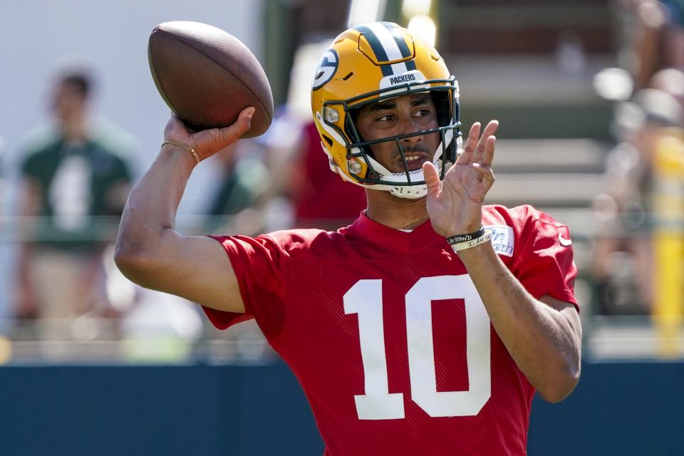 Green Bay Packers' Jordan Love runs a drill at the NFL football team's practice field Saturday, July 30, 2022, in Green Bay, Wis. (AP Photo/Morry Gash)