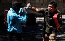 Chinese national Jack Wang, a security trainer at the Chinese-run Deway Security Group leads Kenyan security guards in martial arts combat training at their company compound in Kenya's capital Nairobi, March 13, 2017. REUTERS/Thomas Mukoya