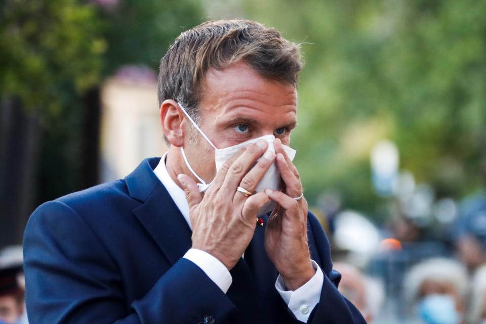 French President Emmanuel Macron wearing a mask. France has seen a sharp uptick in cases in recent days and was removed from the UK's travel exemption list last week. (Getty)