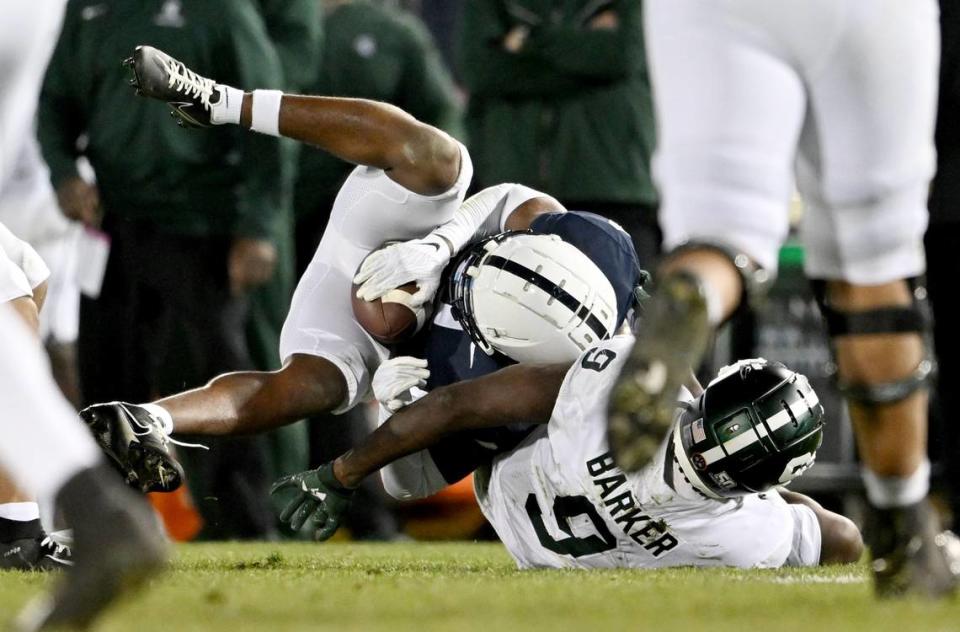 Penn State cornerback Kalen King intercepts the ball that was meant for Michigan State’s Daniel Barker during the game on Saturday, Nov. 26, 2022.