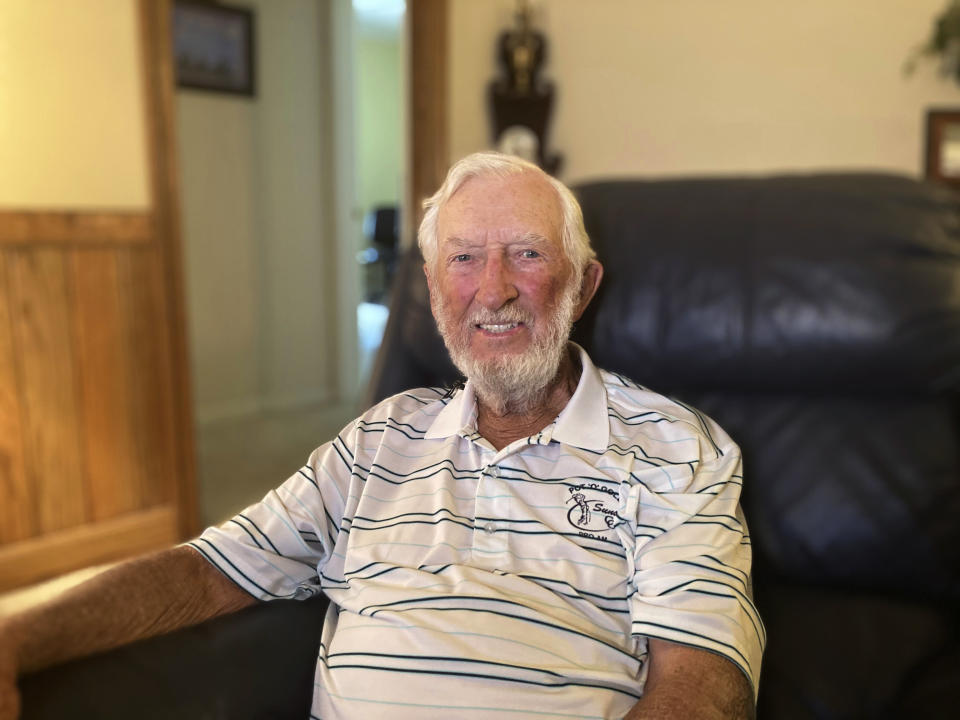 Air Force veteran Max Hancock poses for a photo in his living room, in Moultrie, Georgia, Thursday, April 20, 2023. Hancock, a 19-year-old from Sparks, Georgia, was a U.S. airman stationed at RAF Brize Norton near Oxford at the time of the coronation. As Americans, Hancock and his buddies had no allegiance to the British monarch, but they knew the coronation would be a historic event so they made the 70-mile trip to London by bus and train, then joined the crowds hoping to see the queen pass by. (AP Photo/Sharon Johnson)