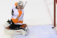 Philadelphia Flyers goaltender Carter Hart (79) looks back as the puck crosses the goal line on a shot by New York Islanders center Leo Komarov during second-period NHL Stanley Cup Eastern Conference playoff hockey game action in Toronto, Saturday, Aug. 29, 2020. (Frank Gunn/The Canadian Press via AP)