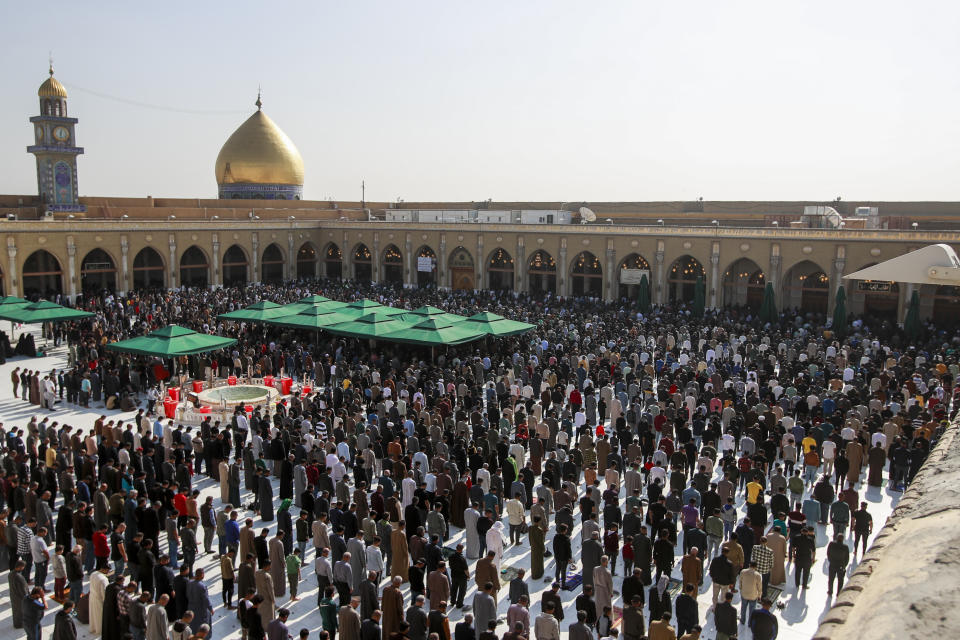 Supporters of the Shiite cleric Muqtada al-Sadr pray during Friday prayers at a mosque in Kufa, Iraq, Friday, Dec. 2, 2022. Al-Sadr who announced his withdrawal from politics four months ago has broken a period of relative silence to launch an anti-LGBTQ campaign. (AP Photo/Anmar Khalil)