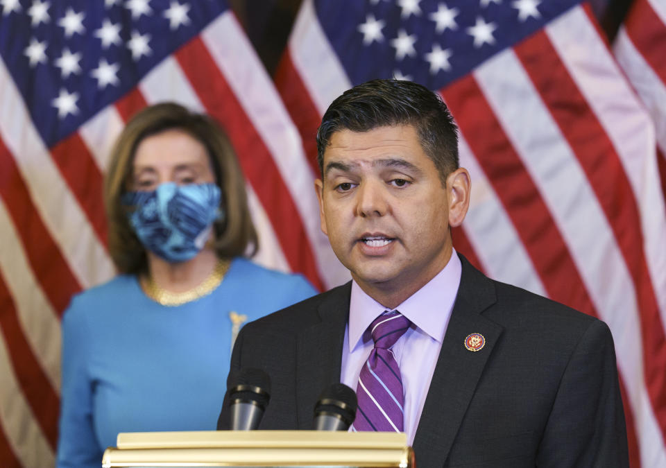 Rep. Raul Ruiz, D-Calif., chairman of the House Hispanic Caucus, joins Speaker of the House Nancy Pelosi, D-Calif., left, to discuss the upcoming vote on the American Dream and Promise Act of 2021, a bill to help reform the immigration system, at the Capitol in Washington, Thursday, March 18, 2021. (AP Photo/J. Scott Applewhite)