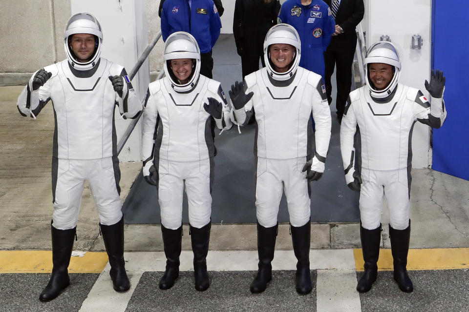 The Crew Dragon space capsule astronauts, from front left, European Space Agency astronaut Thomas Pesquet, NASA astronaut Megan McArthur, NASA astronaut Shane Kimbrough and Japan Aerospace Exploration Agency astronaut Akihiko Hoshide leave the Operation and Checkout Building on their way to board the capsule for a mission to the International Space Station at the Kennedy Space Center in Cape Canaveral, Fla., Friday, April 23, 2021. (AP Photo/John Raoux)