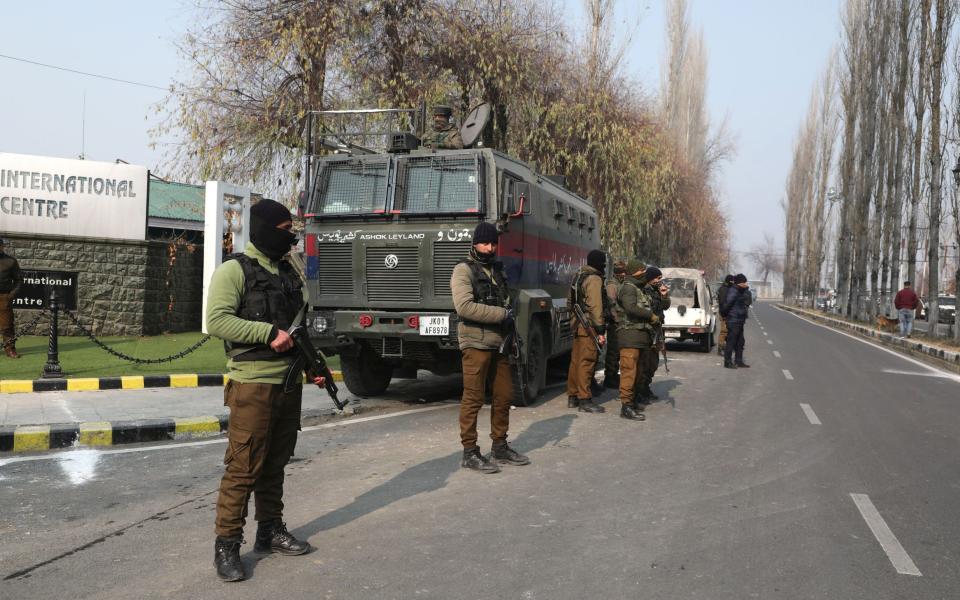 Armed policeman protect a polling place - Farooq Khan/Shutterstock/EPA-EFE