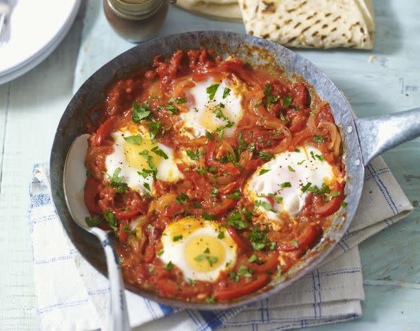 Credit: Stuart West (c) Dorling Kindersley/Getty Images Shakshouka, a dish of eggs baked with tomato and peppers