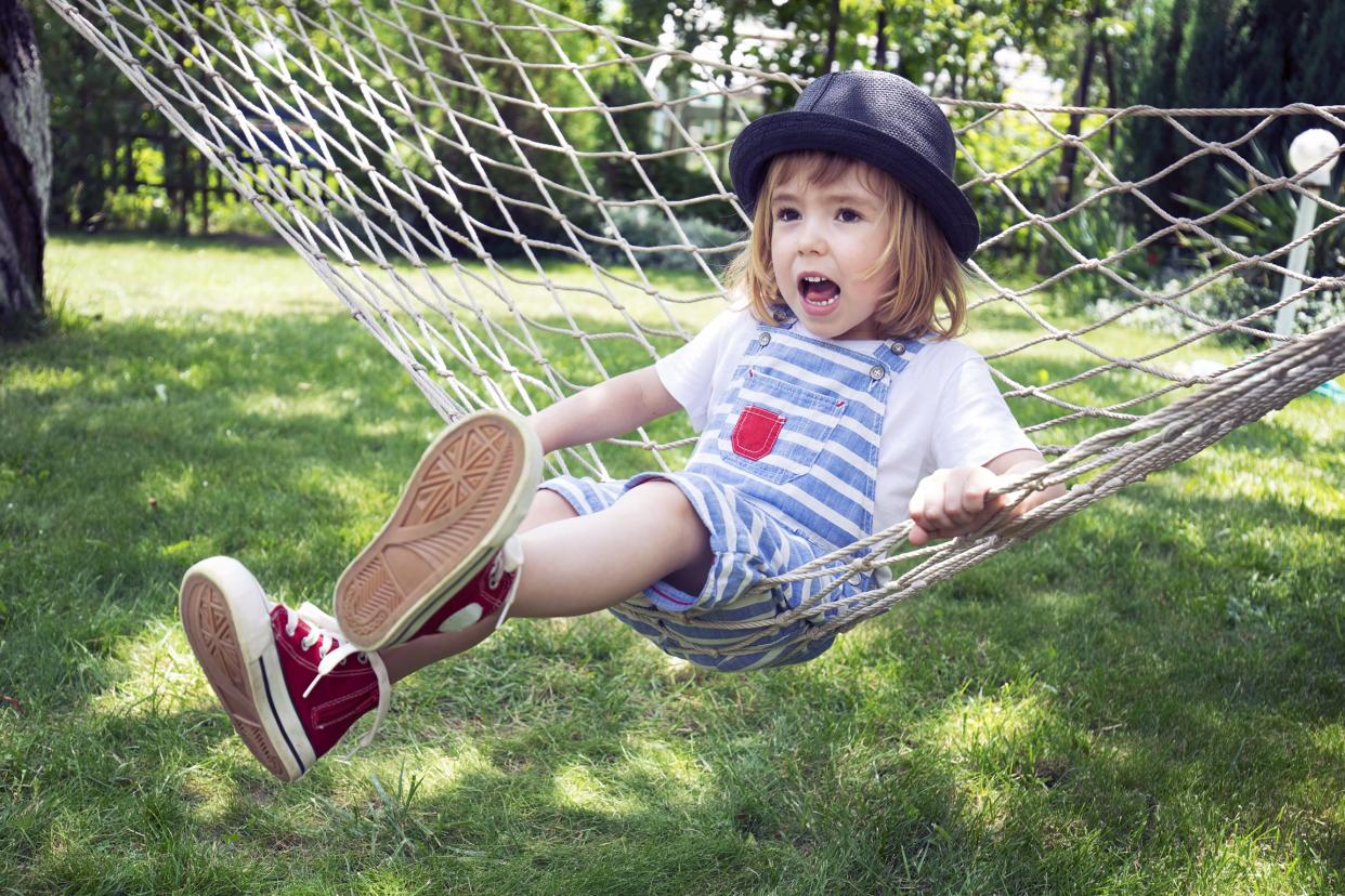 Young girl lying on a hammock