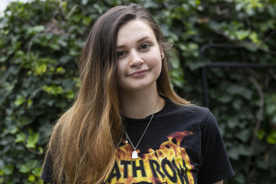 Kara Apuzzo poses for a portrait Thursday, Aug. 13, 2020, in New Haven, Conn. Educational disruptions forced by the coronavirus pandemic are hurting teenagers who also may need to work and help their families care for young kids. (AP Photo/Frank Franklin II)