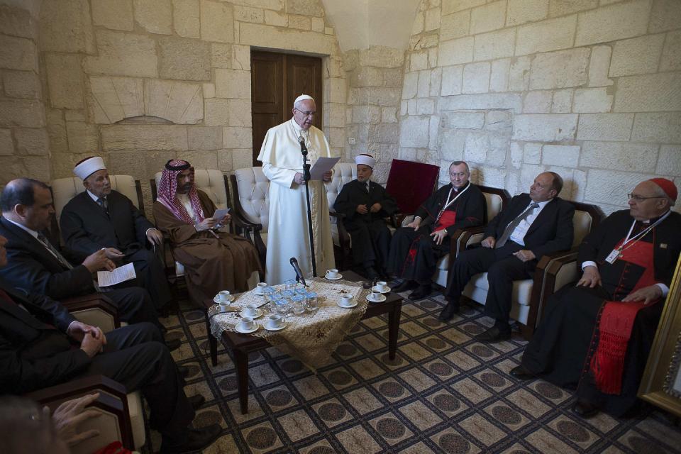 Pope Francis reads a message during a visit to the compound known to Muslims as Noble Sanctuary and to Jews as Temple Mount in Jerusalem's Old City