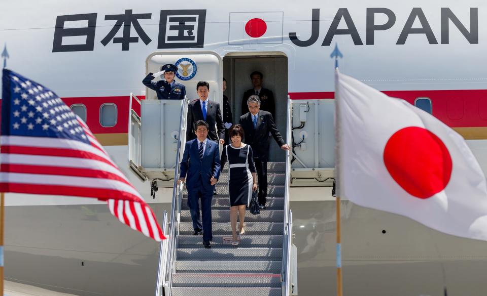 Prime Minister Shinzo Abe and his wife  Akie Abe, arrive at Palm Beach International Airport, April 17, in West Palm Beach, Florida. The Prime Minister will meet with President Donald Trump at Mar-a-Lago. 