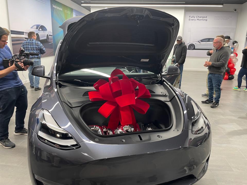 A Tesla Model Y Performance at the new showroom at Mohegan Sun. When people weren't in it, the car was set to light show mode, so it would flash its lights and open and close its doors as if it were dancing, set to a rendition of "Auld Lang Syne."