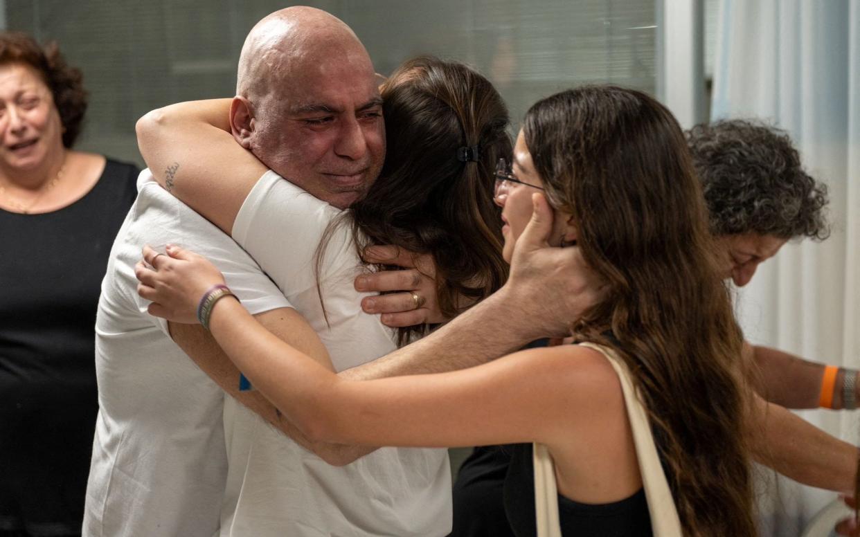 Shlomi Ziv, a rescued Israeli hostage, embraces his loved ones