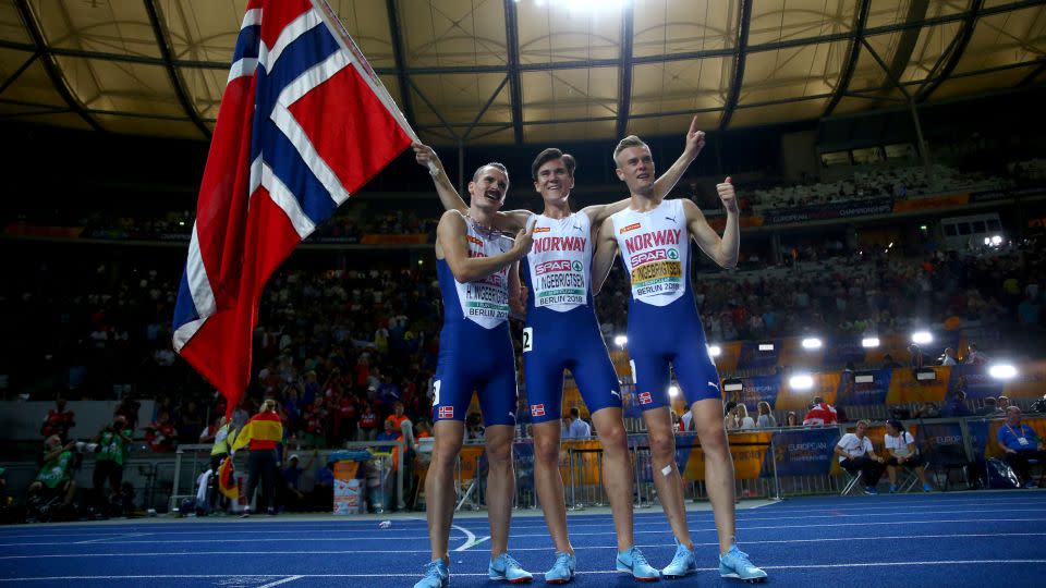 Henrik, Jakob and Filip Ingebrigsten celebrate Jakob's gold medal in the 1,500 meters at the 2018 European Championships in Berlin. - Michael Steele/Getty Images