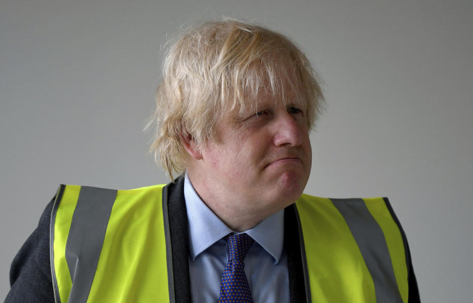 Britain's Prime Minister Boris Johnson visits the construction site of Ealing Fields High School in west London, Monday June 29, 2020. (Toby Melville/Pool via AP)