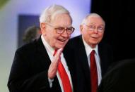 FILE PHOTO: Berkshire Hathaway Chairman Buffett and Vice Chairman Munger arrive to begin the company's annual meeting in Omaha