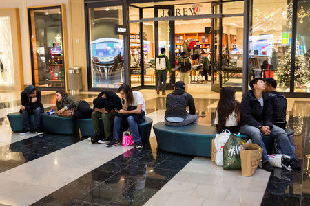 FILE PHOTO: People rest in Westfield San Francisco Centre during Black Friday in San Francisco, California November 29, 2013. REUTERS/Stephen Lam/File Photo