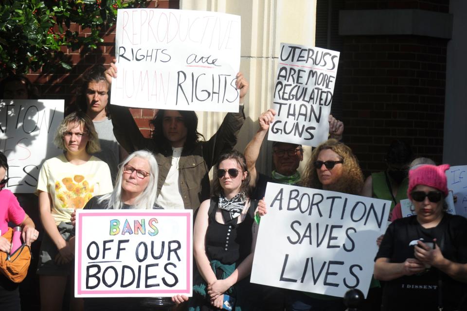 Demonstrators in downtown Knoxville voice their opposition May 3 to the leaked U.S. Supreme Court draft ruling that suggests the court is considering overturning the 1973 Roe v. Wade ruling.