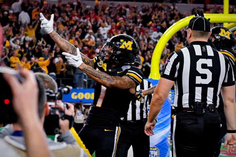 Dec 29, 2023; Arlington, TX, USA; Missouri Tigers wide receiver Theo Wease Jr. (1) celebrates after wide receiver Luther Burden III (3) catches a pass for a touchdown against the Ohio State Buckeyes during the fourth quarter at AT&T Stadium. Mandatory Credit: Jerome Miron-USA TODAY Sports