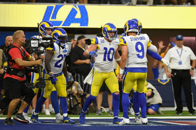 Wide receiver Cooper Kupp (10) of the Los Angeles Rams celebrates with quarterback Matthew Stafford (9) after catching a 4-yard touchdown against the Bills. (Photo by Kevork Djansezian/Getty Images)