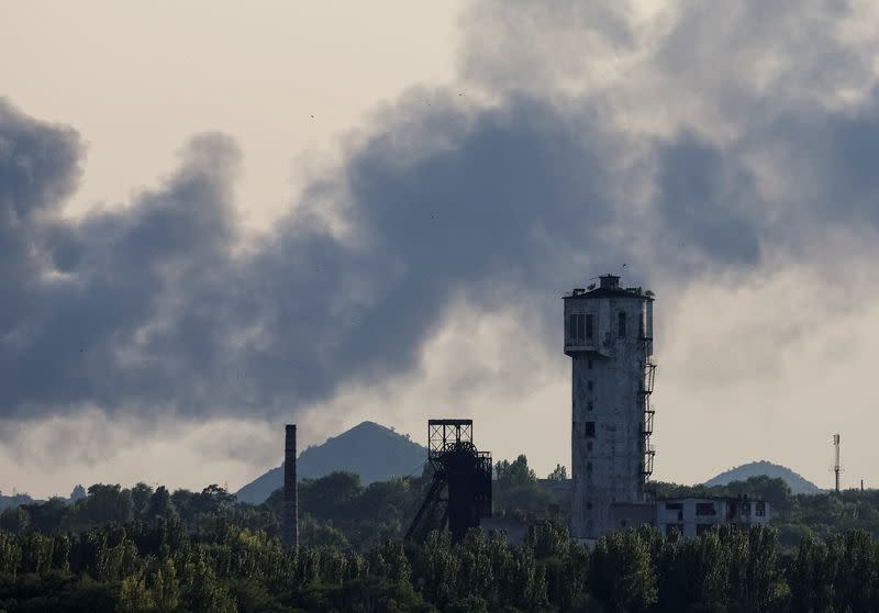 Smoke rises after shelling during Ukraine-Russia conflict in Donetsk