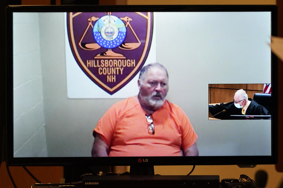 Defendant Gordon Searles appears on video for a bail hearing as Judge William Lyons presides, at right, Monday, April 12, 2021, in Manchester, N.H., in connection with sexual abuse allegations at the Sununu Youth Services Center, a state-run youth detention center. (AP Photo/Elise Amendola, Pool)