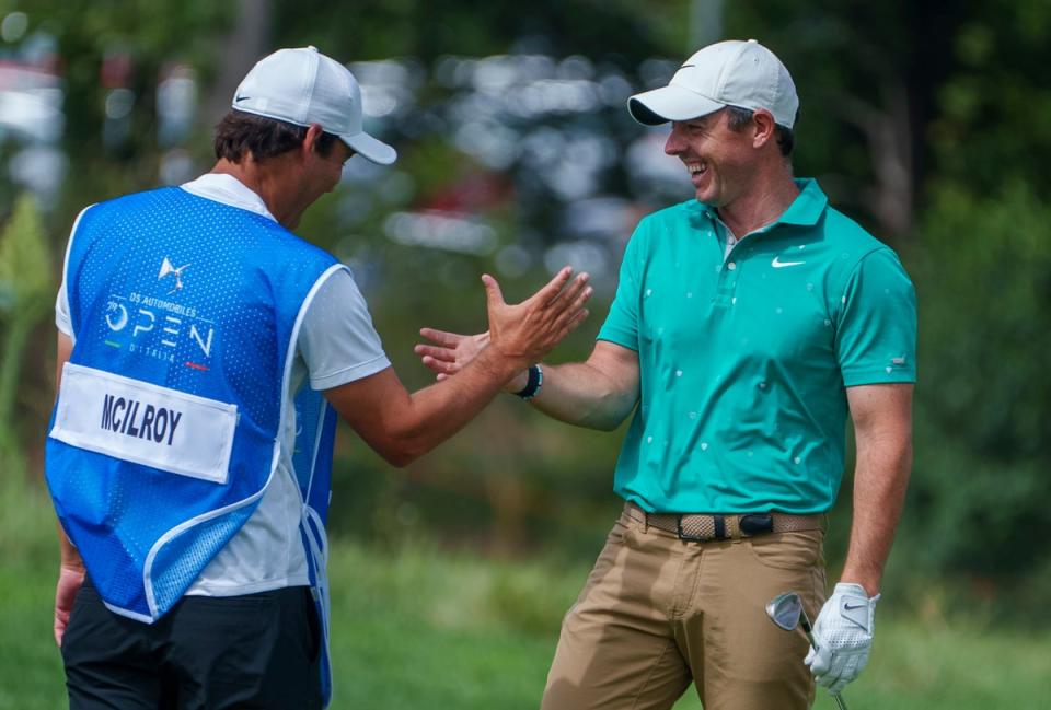 Rory McIlroy (right) is congratulated by his caddie Harry Diamond after his eagle during the first round of the Italian Open (Domenico Stinellis/AP) (AP)